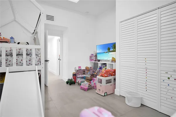 a bed room with a bed and a couch