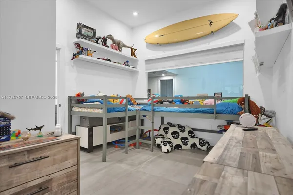 a bedroom with a bed and a table in it