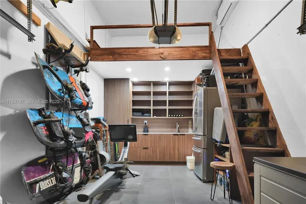 a view of a patio with table and chairs potted plants