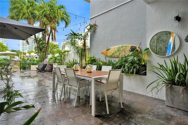 a table that has a bunch of chairs in it