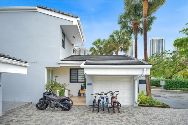 a group of people sitting in front of a building