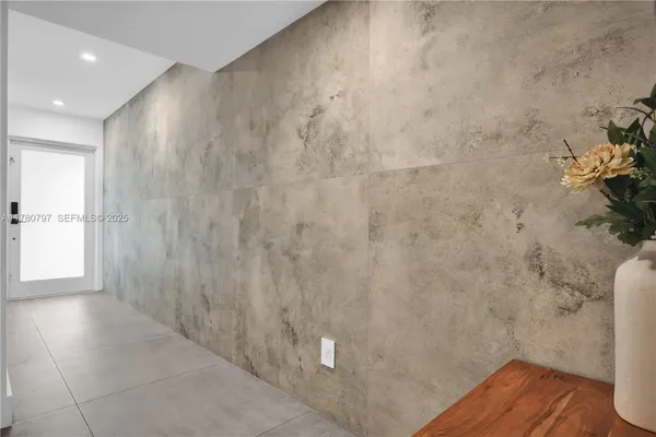 a dining room with furniture and a large window