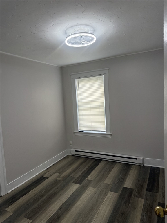 23 Everett Avenue, Unit 1 Webster, MA 01570 - Photo 4 of 9 an empty room with a window