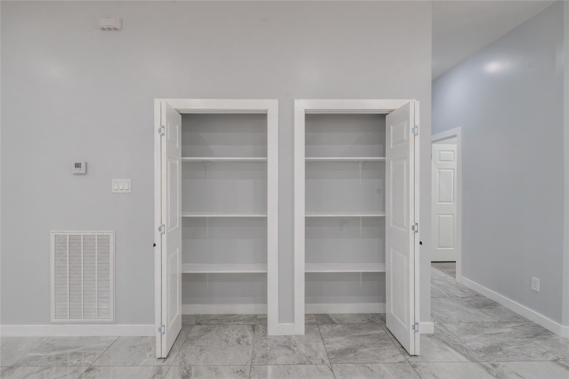 164 County Road 3370 Cleveland, TX 77327 - Photo 14 of 28 a view of walk in closet with empty racks