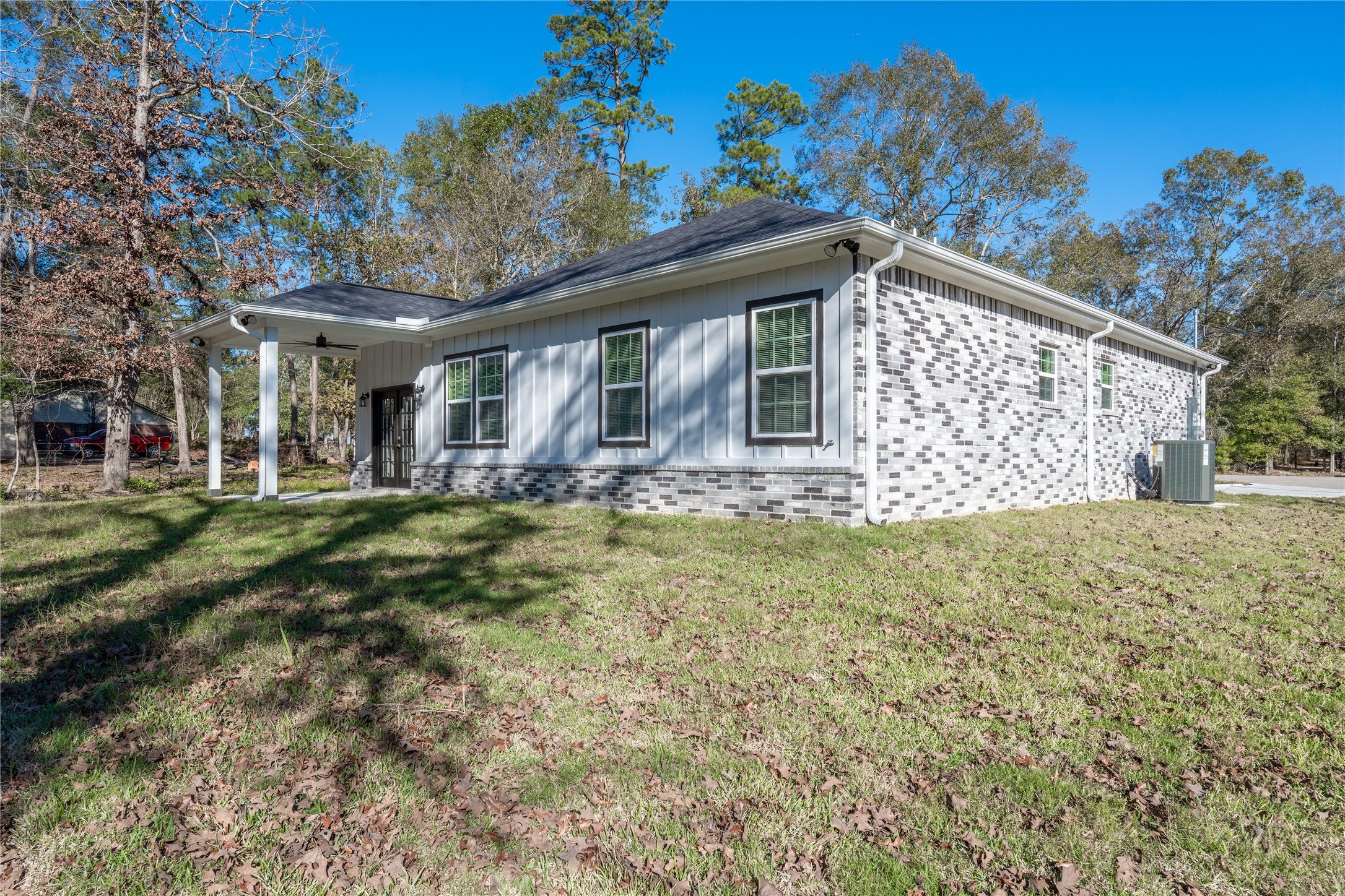 164 County Road 3370 Cleveland, TX 77327 - Photo 27 of 28 a view of a house with a yard