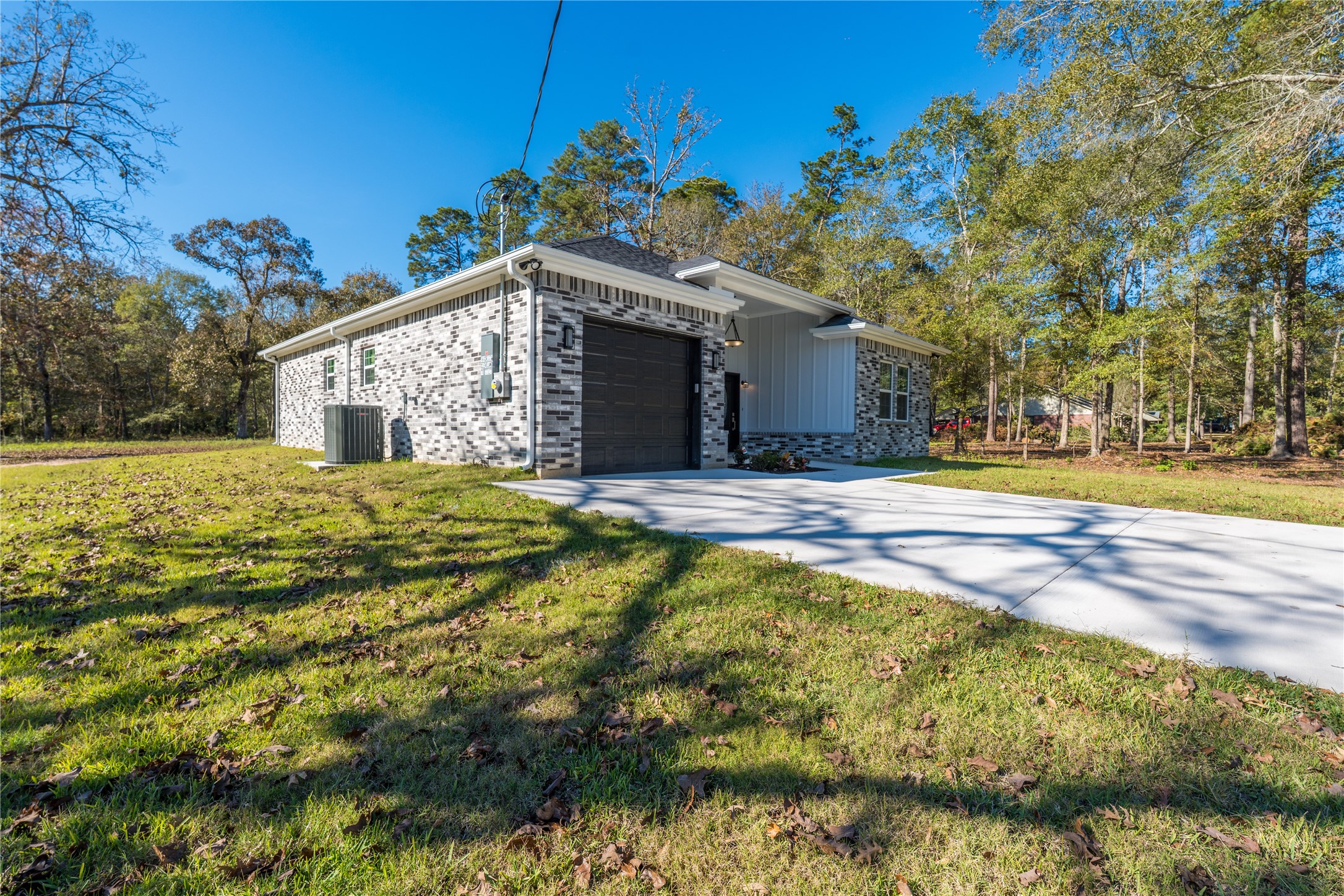 164 County Road 3370 Cleveland, TX 77327 - Photo 3 of 28 a house view with swimming pool in front of the house
