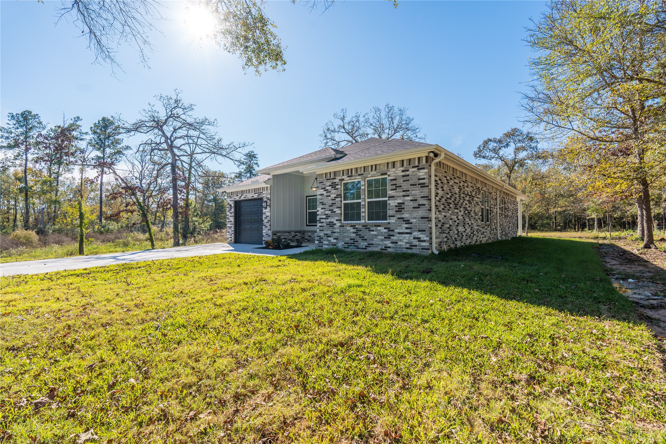 164 County Road 3370 Cleveland, TX 77327 - Photo 4 of 28 a view of a house with a yard