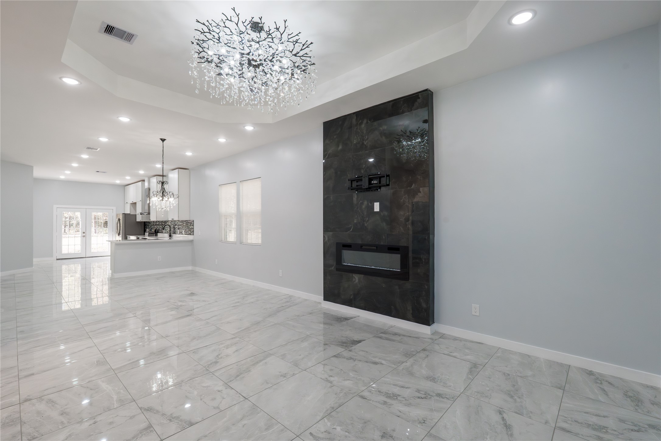 164 County Road 3370 Cleveland, TX 77327 - Photo 9 of 28 a view of a hallway with a kitchen