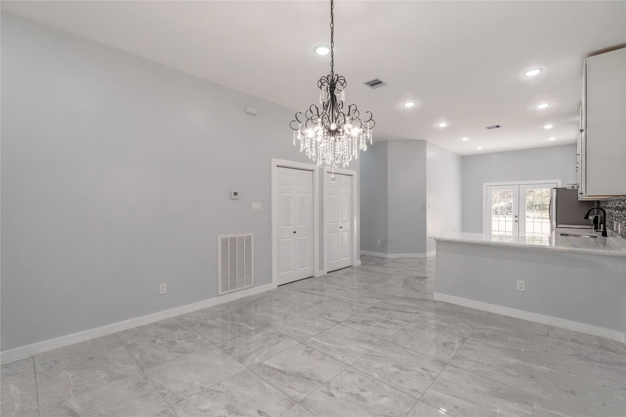 164 County Road 3370 Cleveland, TX 77327 - Photo 10 of 28 a view of a hallway with chandelier and chandelier