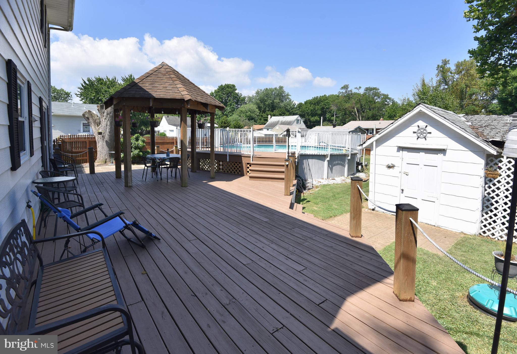 7826 Harbor Road Pasadena, MD 21122 - Photo 12 of 66 Great deck for enjoying the beautiful backyard.