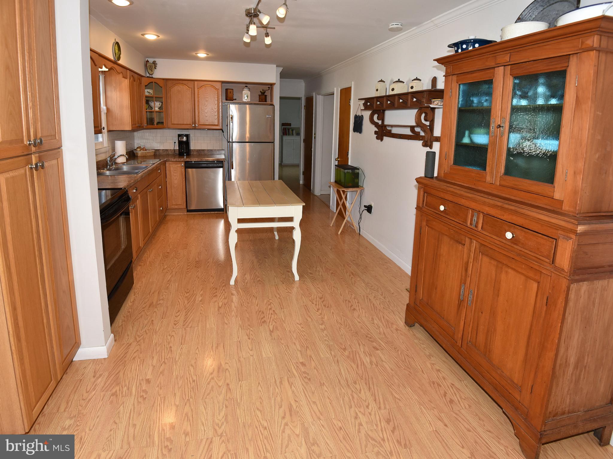 7826 Harbor Road Pasadena, MD 21122 - Photo 36 of 66 Lighter hardwood floors in the kitchen.