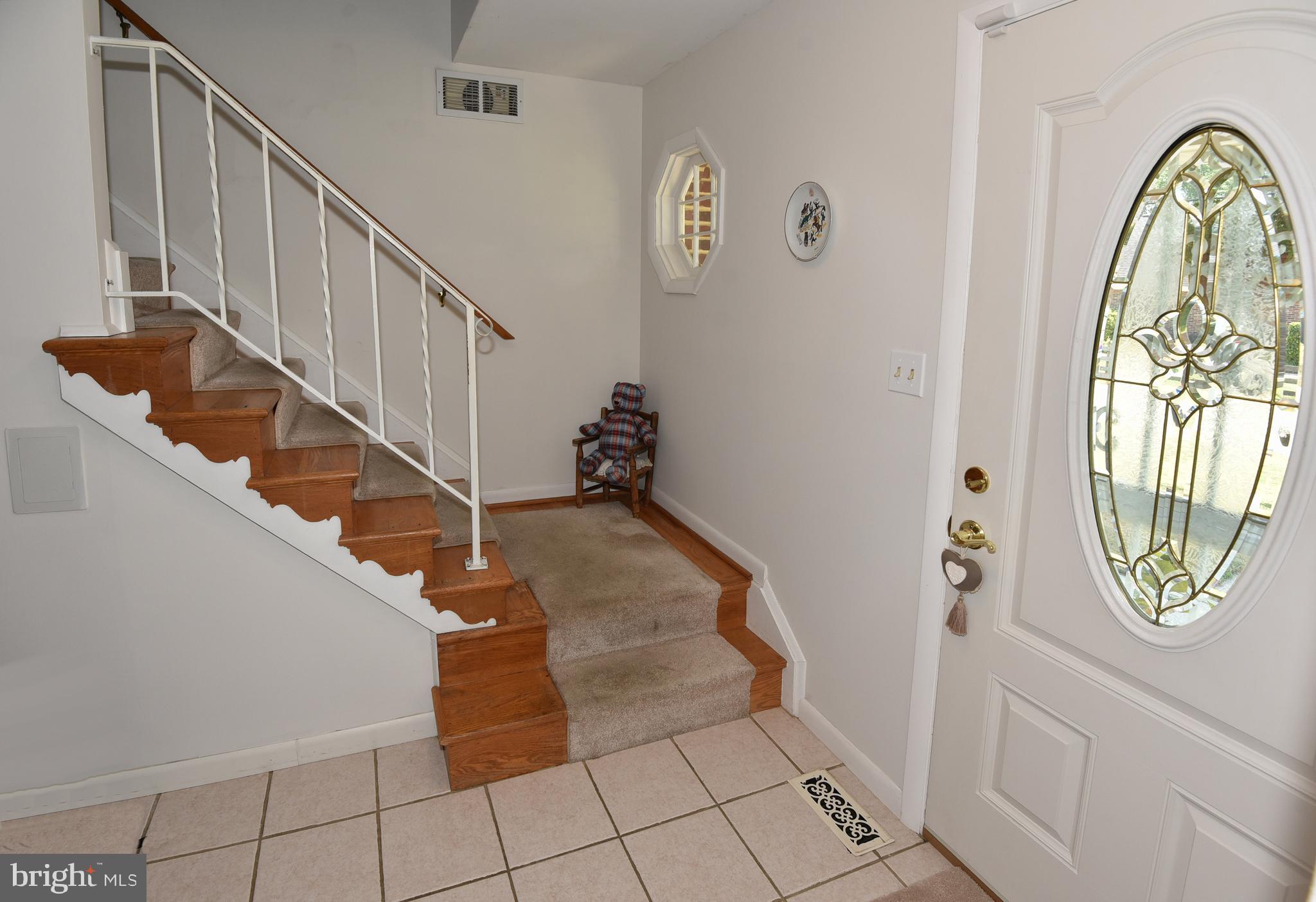 7826 Harbor Road Pasadena, MD 21122 - Photo 43 of 66 Foyer and stairs to second floor.