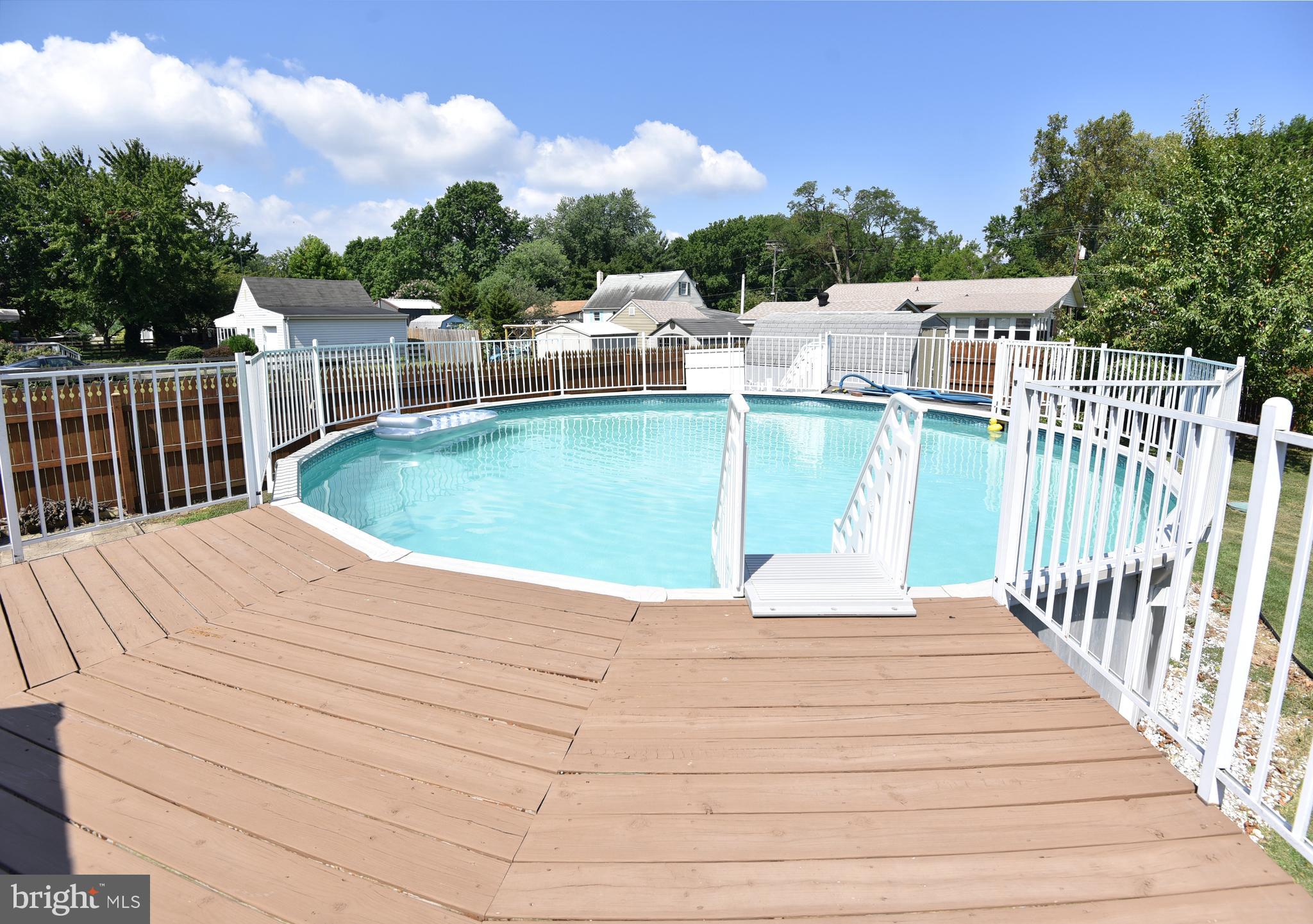 7826 Harbor Road Pasadena, MD 21122 - Photo 7 of 66 Gorgeous above ground pool off the deck.