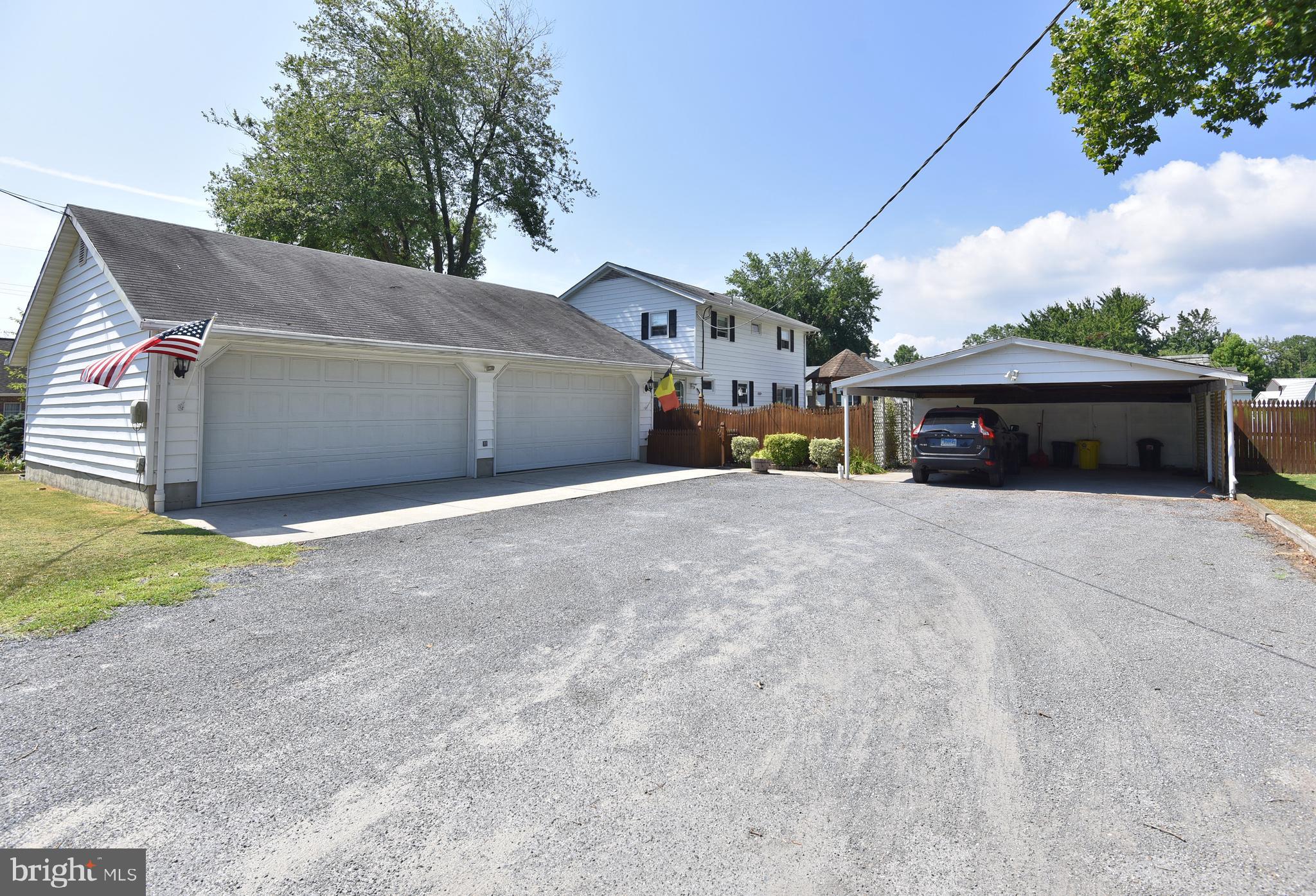7826 Harbor Road Pasadena, MD 21122 - Photo 8 of 66 Large driveway with 2 car garage and carport.