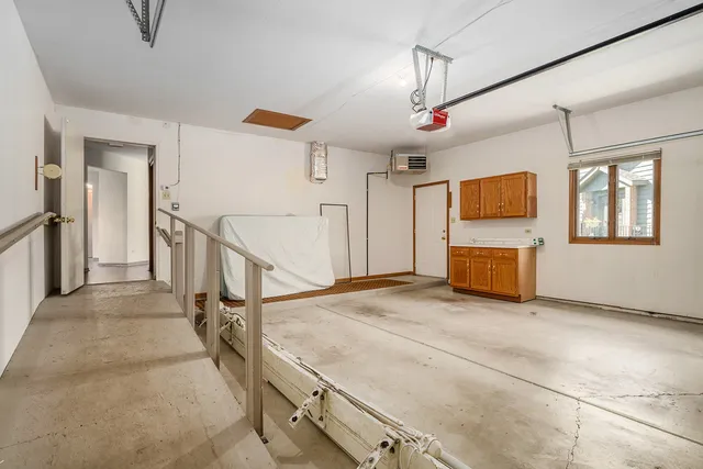 a view of a livingroom with wooden furniture and flat screen tv