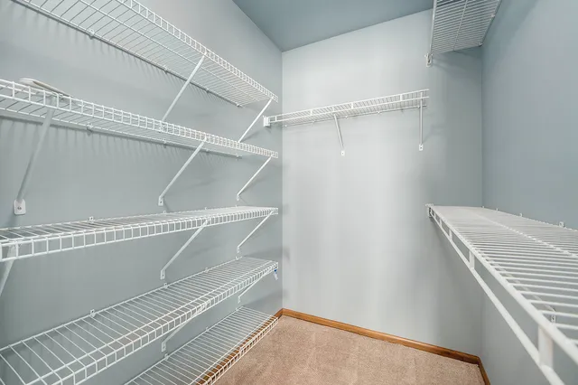 a view of an empty walk in closet