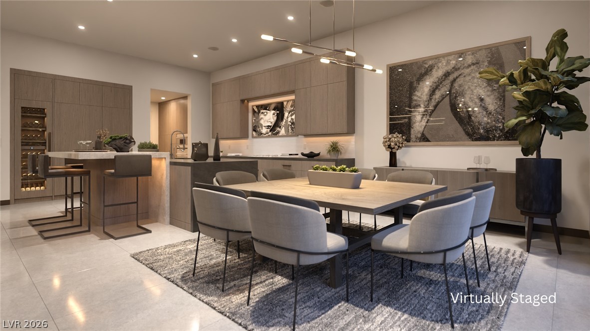 543 Overlook Rim Drive Henderson, NV 89012 - Photo 4 of 19 A contemporary dining area features direct access to a well-appointed kitchen.