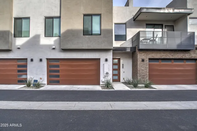a front view of a house with garage
