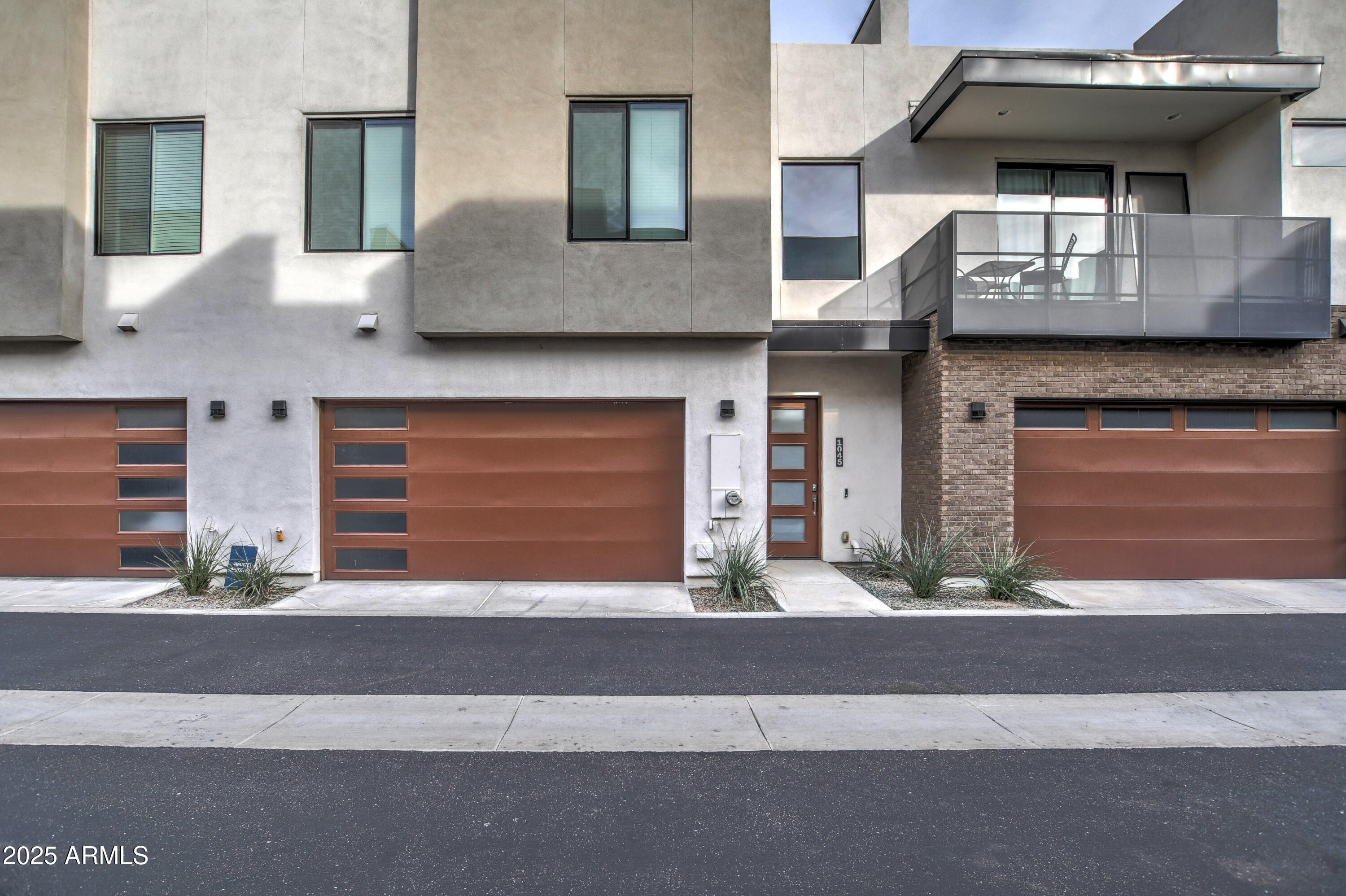 a front view of a house with garage