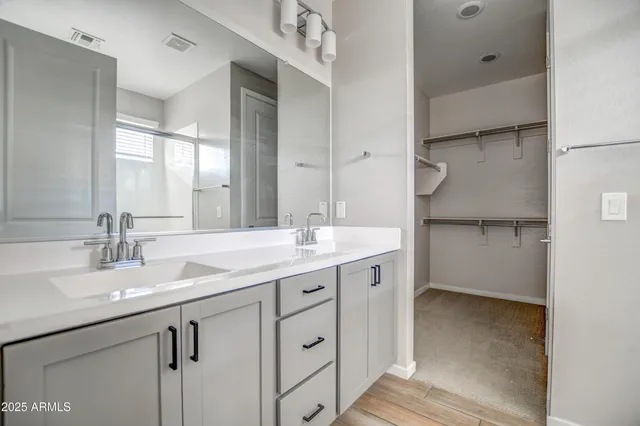a bathroom with a shower and a glass door