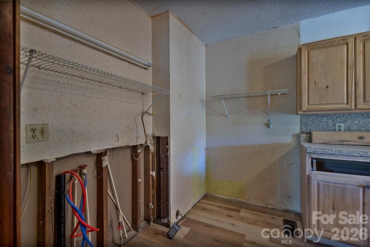 156 Old Sweetwater Road Robbinsville, NC 28771 - Photo 13 of 25 a view of walk in closet with clothes and shoes
