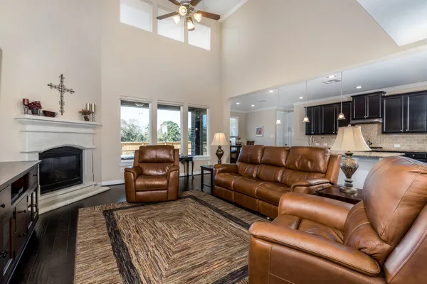 a living room with furniture and a fireplace