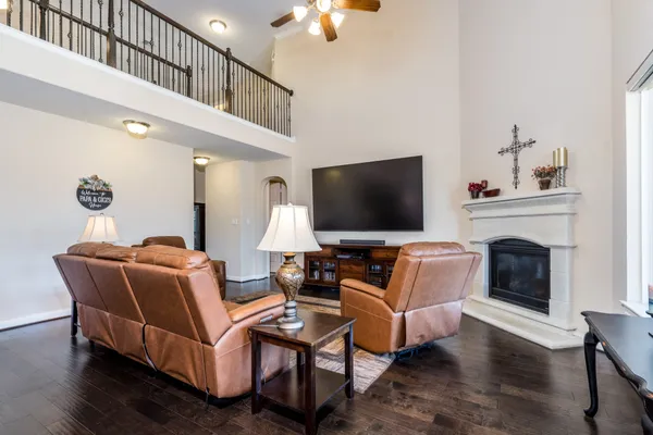 a living room with furniture fireplace and flat screen tv