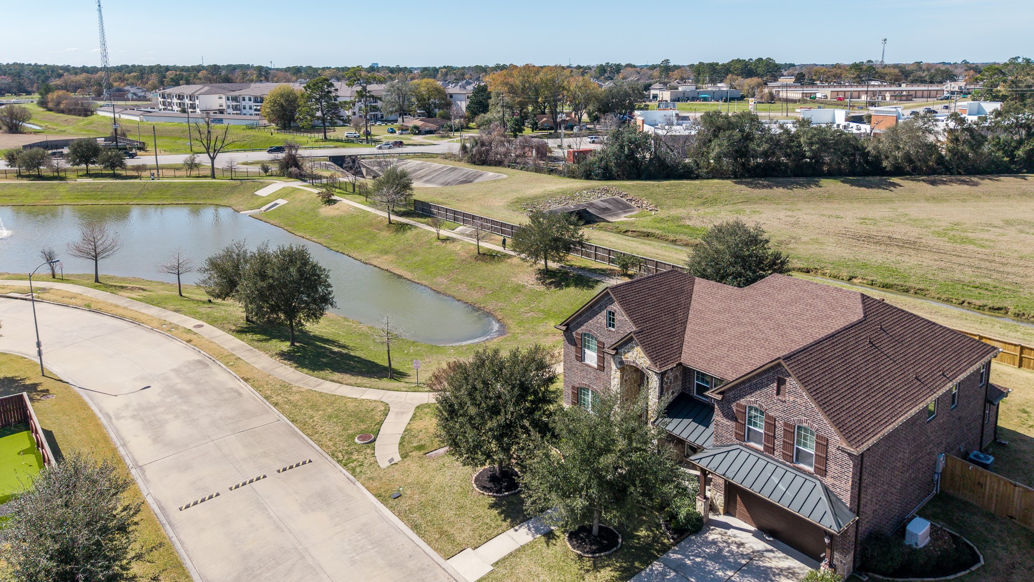 6231 Warwick Garden Lane Spring, TX 77379 - Photo 2 of 50 an aerial view of a house with a lake view