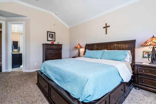 a bedroom with a bed and dresser