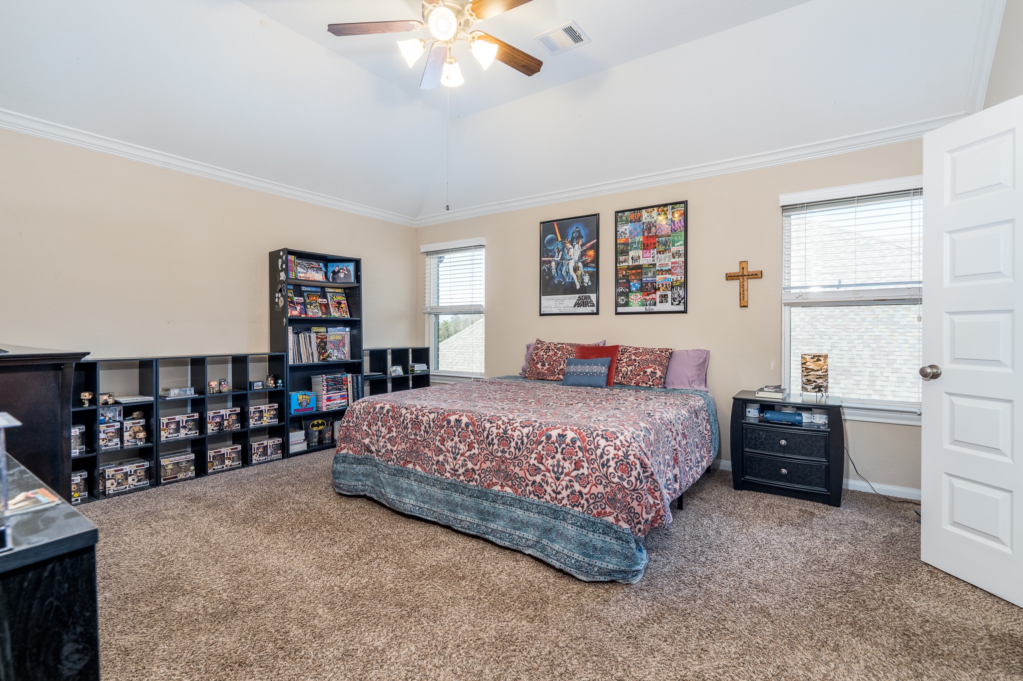 6231 Warwick Garden Lane Spring, TX 77379 - Photo 27 of 50 a bedroom with a bed and a cabinets