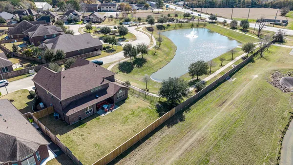 an aerial view of a house with a swimming pool