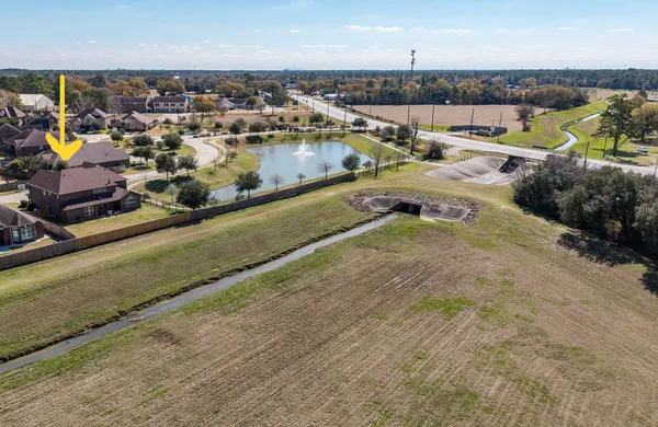 an aerial view of a house with a ocean view