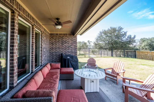 a outdoor living space with furniture and city view