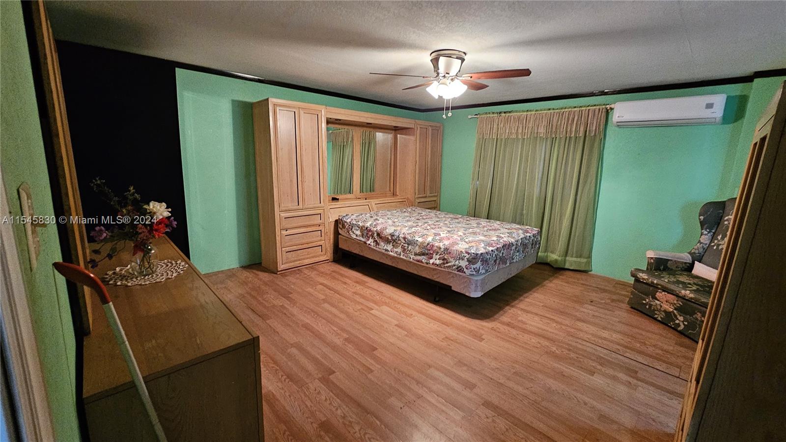 1823 John Road Clewiston, FL 33440 - Photo 11 of 34 a bedroom with bed and a large window