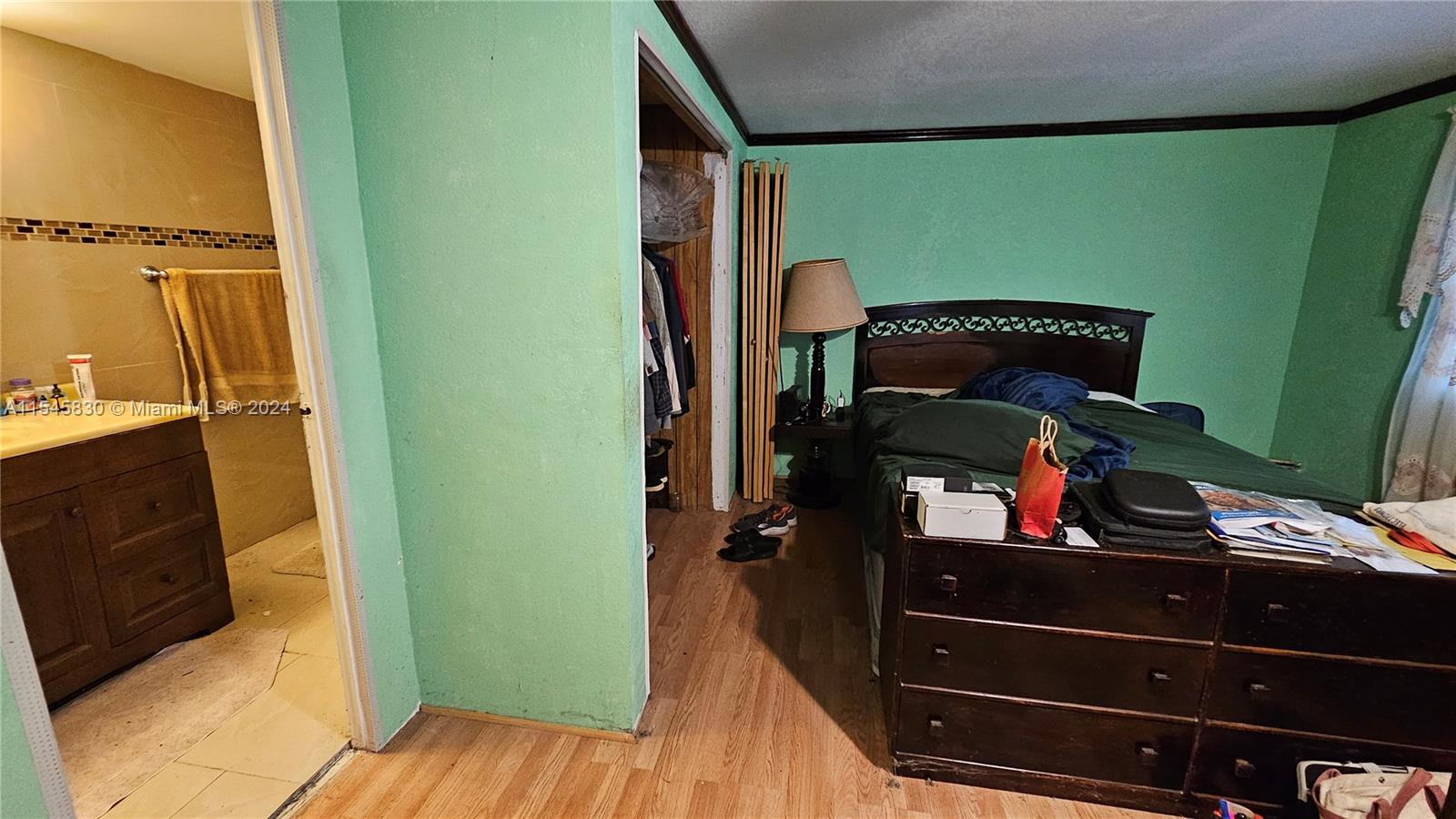 1823 John Road Clewiston, FL 33440 - Photo 12 of 34 a view of a closet with wooden floor