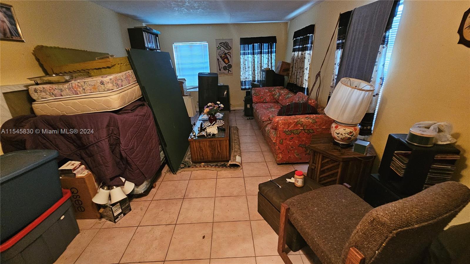 1823 John Road Clewiston, FL 33440 - Photo 19 of 34 a living room with furniture and a flat screen tv
