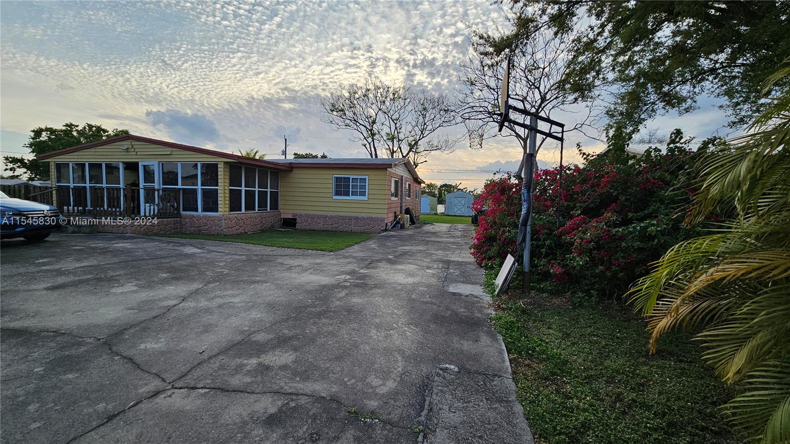 1823 John Road Clewiston, FL 33440 - Photo 2 of 34 a view of a house with a yard and trees