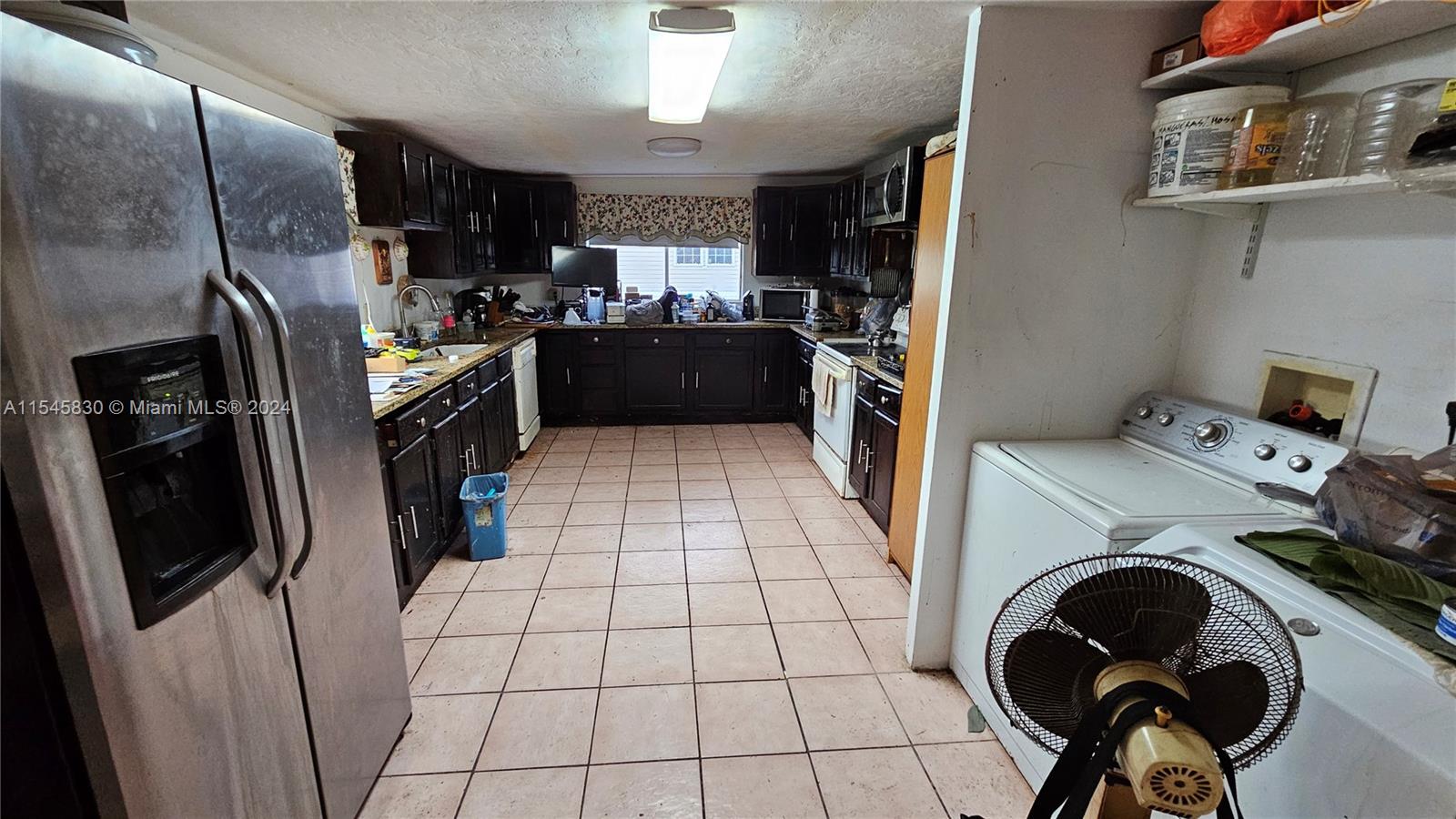 1823 John Road Clewiston, FL 33440 - Photo 24 of 34 a view of a storage & utility room with washer and dryer