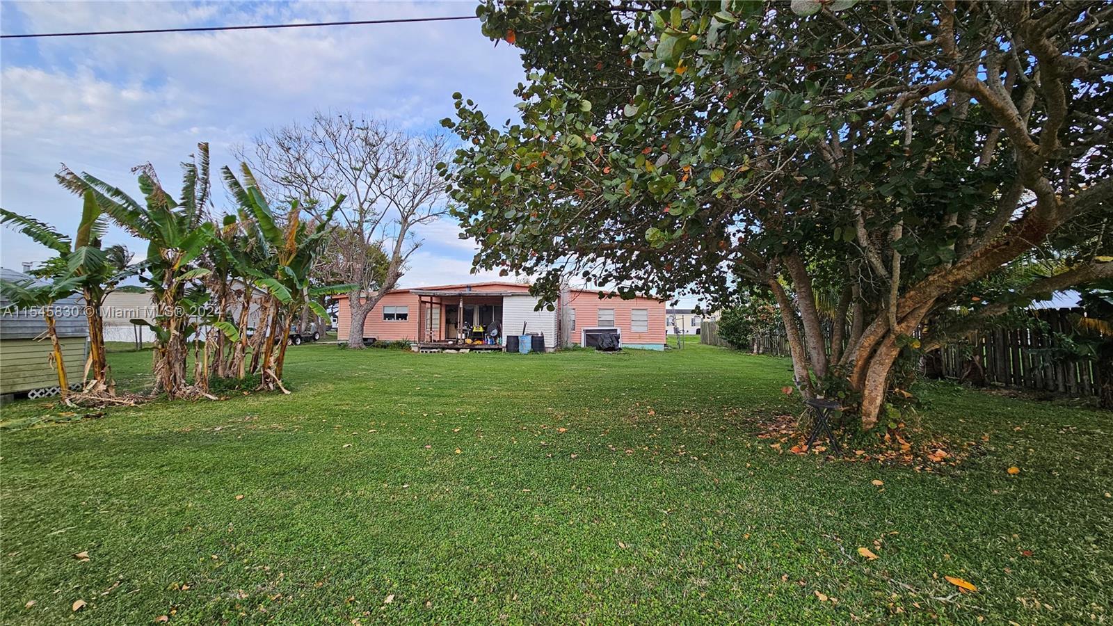 1823 John Road Clewiston, FL 33440 - Photo 31 of 34 a view of a house with a yard