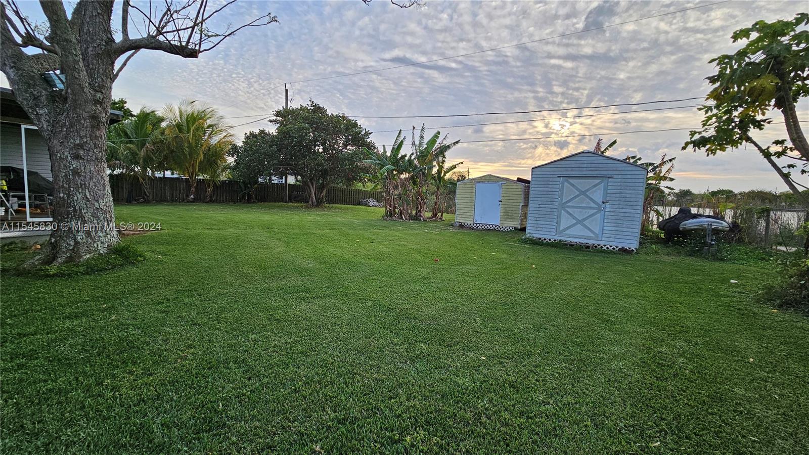 1823 John Road Clewiston, FL 33440 - Photo 32 of 34 a view of a large garden with plants and large trees
