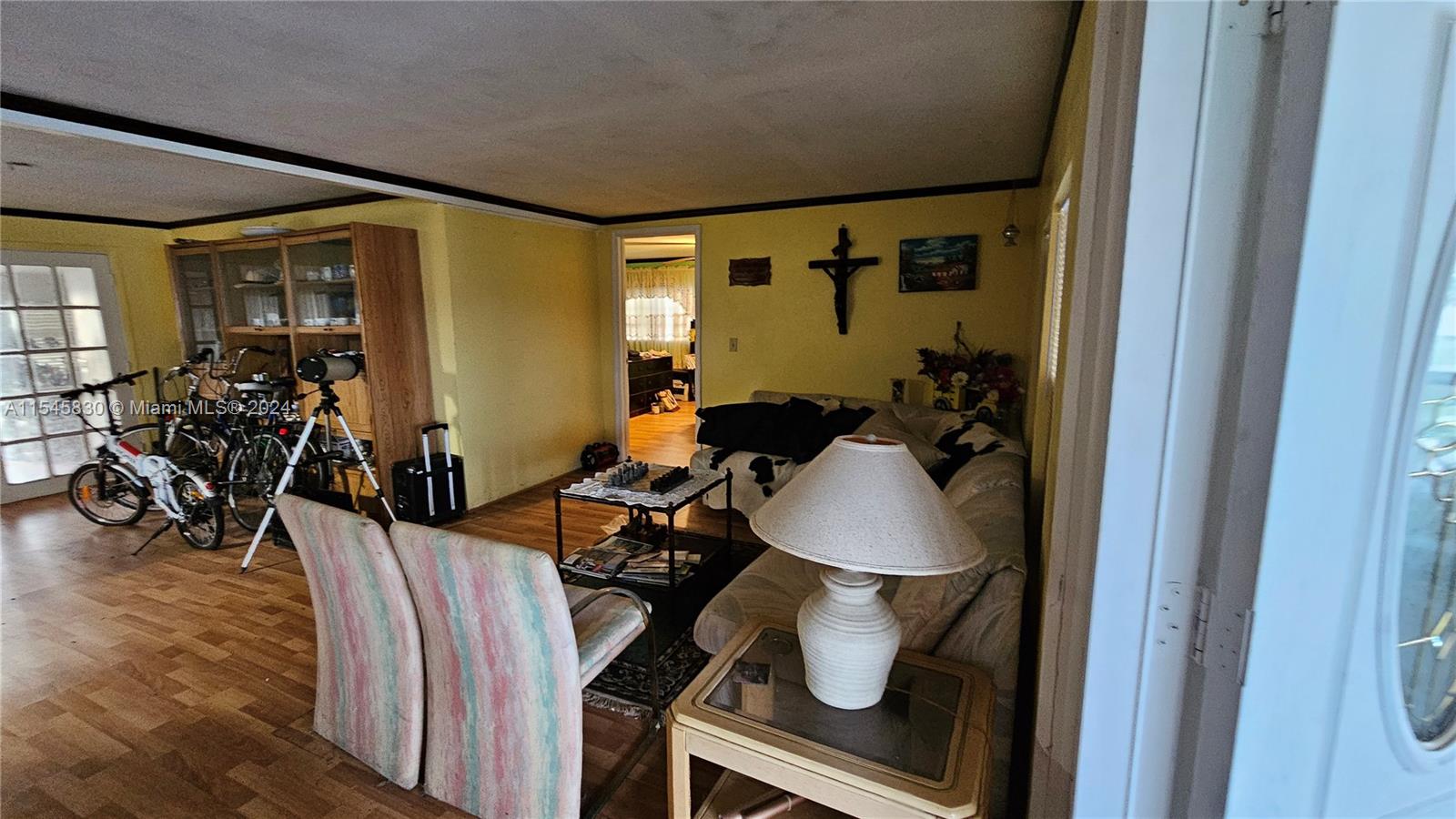 1823 John Road Clewiston, FL 33440 - Photo 8 of 34 a view of a livingroom with furniture and wooden floor
