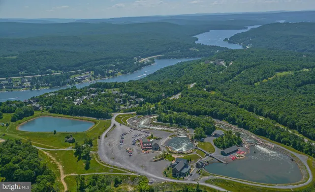 an aerial view of a house having yard