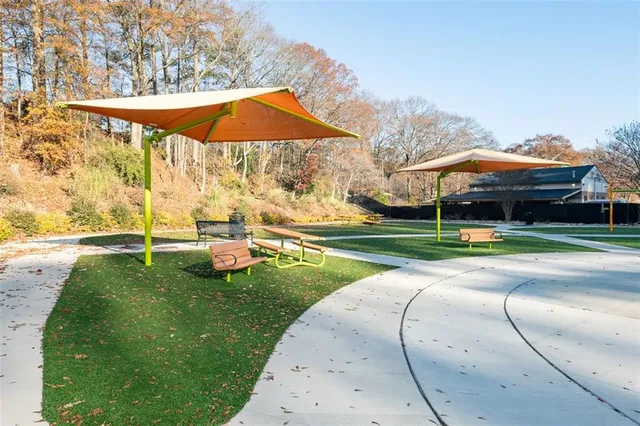 a view of a park with large trees