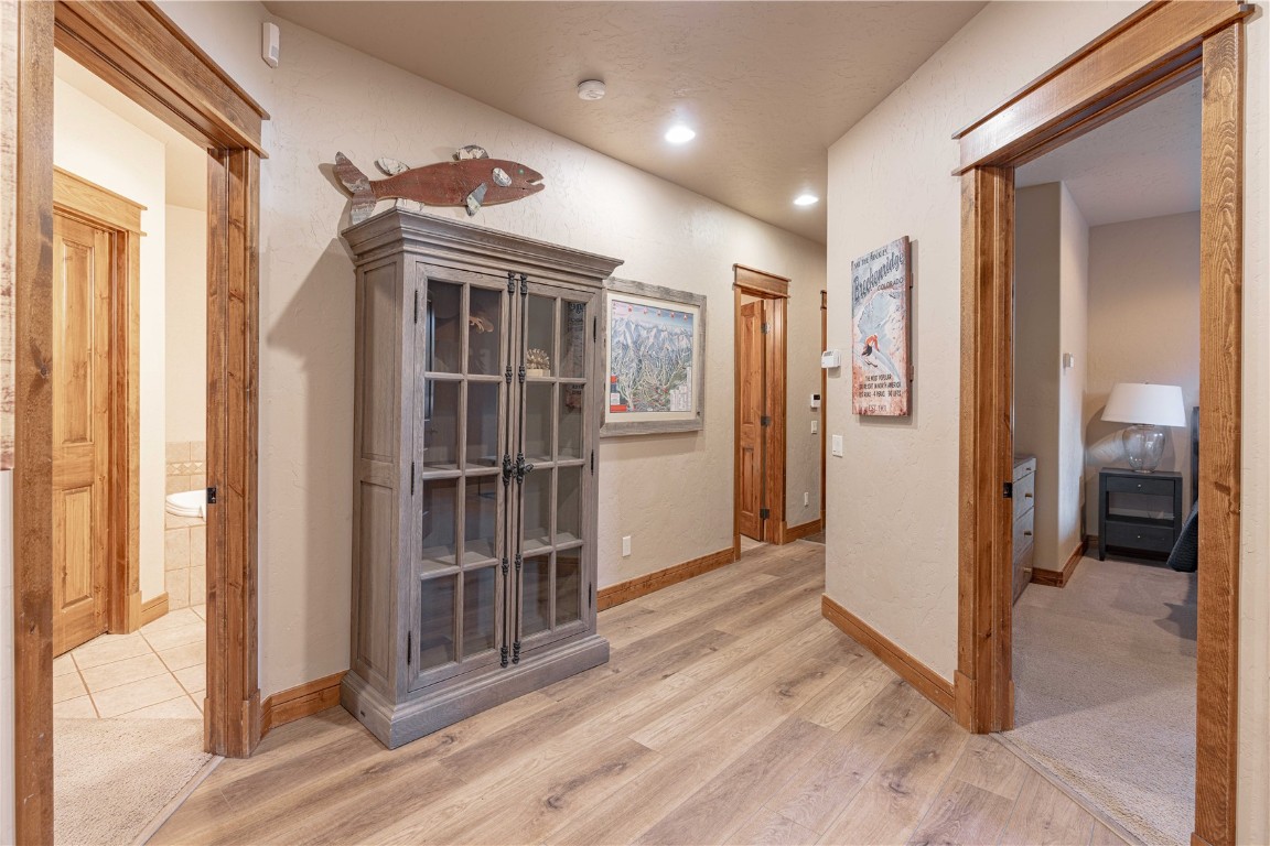 71 Cucumber Patch Placer Road, Unit 7 Breckenridge, CO 80424 - Photo 12 of 21 a view of a hallway with wooden floor and entryway