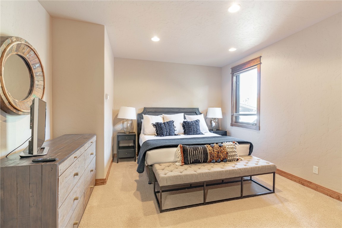 71 Cucumber Patch Placer Road, Unit 7 Breckenridge, CO 80424 - Photo 15 of 21 a spacious bedroom with a bed and window