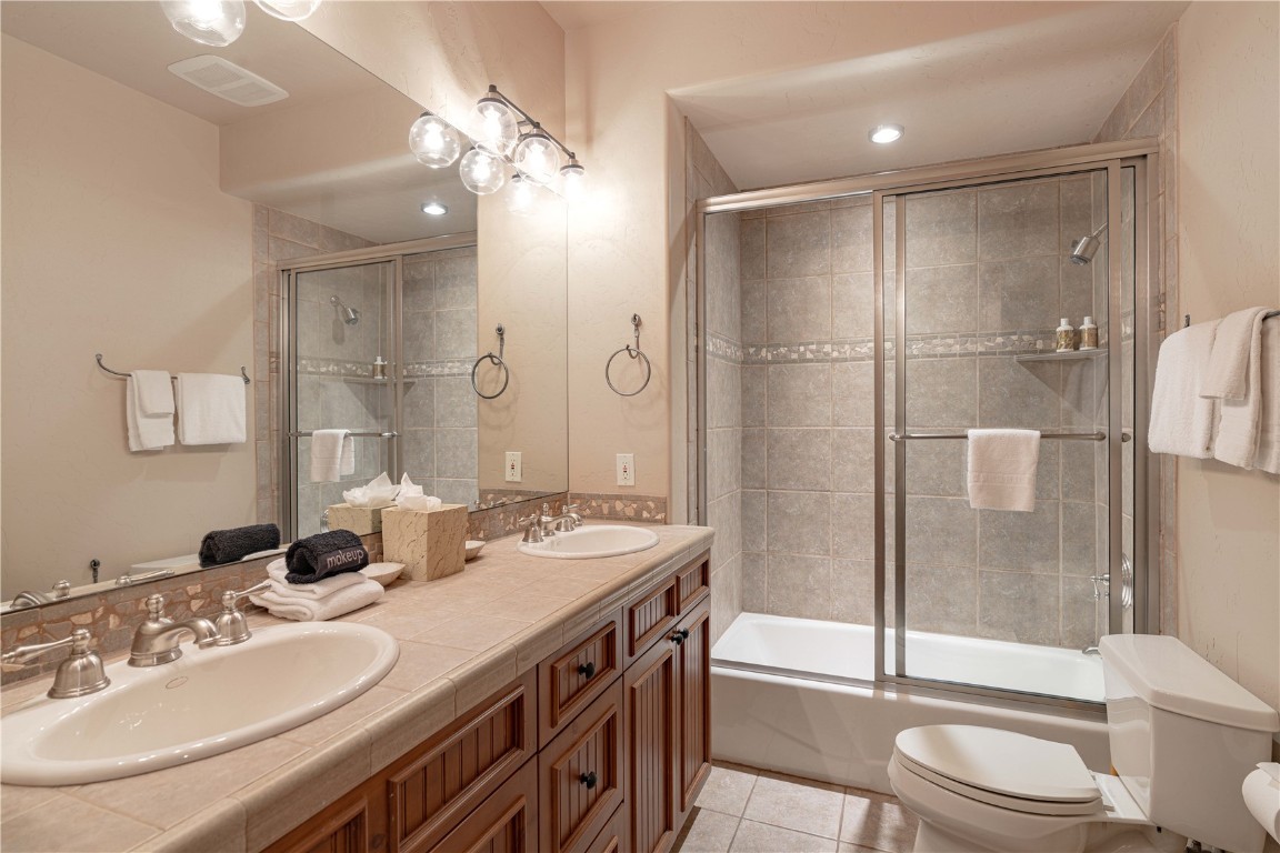 71 Cucumber Patch Placer Road, Unit 7 Breckenridge, CO 80424 - Photo 16 of 21 a bathroom with a sink a toilet and shower