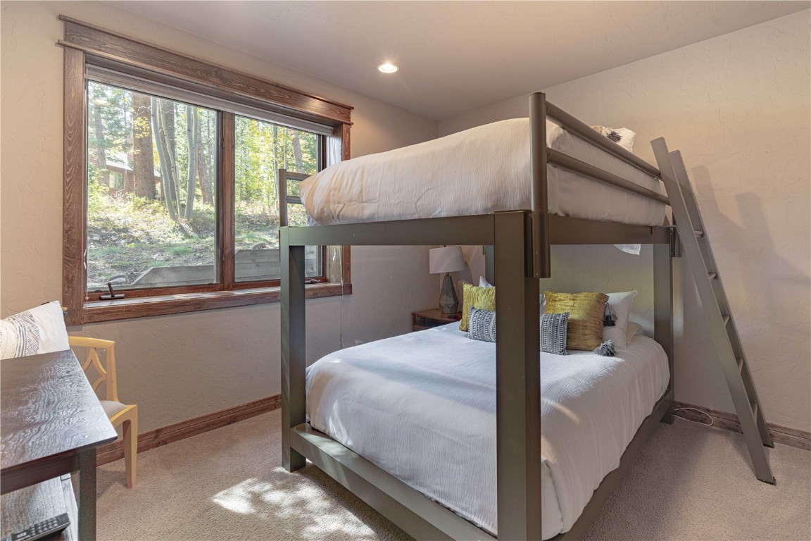 71 Cucumber Patch Placer Road, Unit 7 Breckenridge, CO 80424 - Photo 17 of 21 a bedroom with a bed and a window
