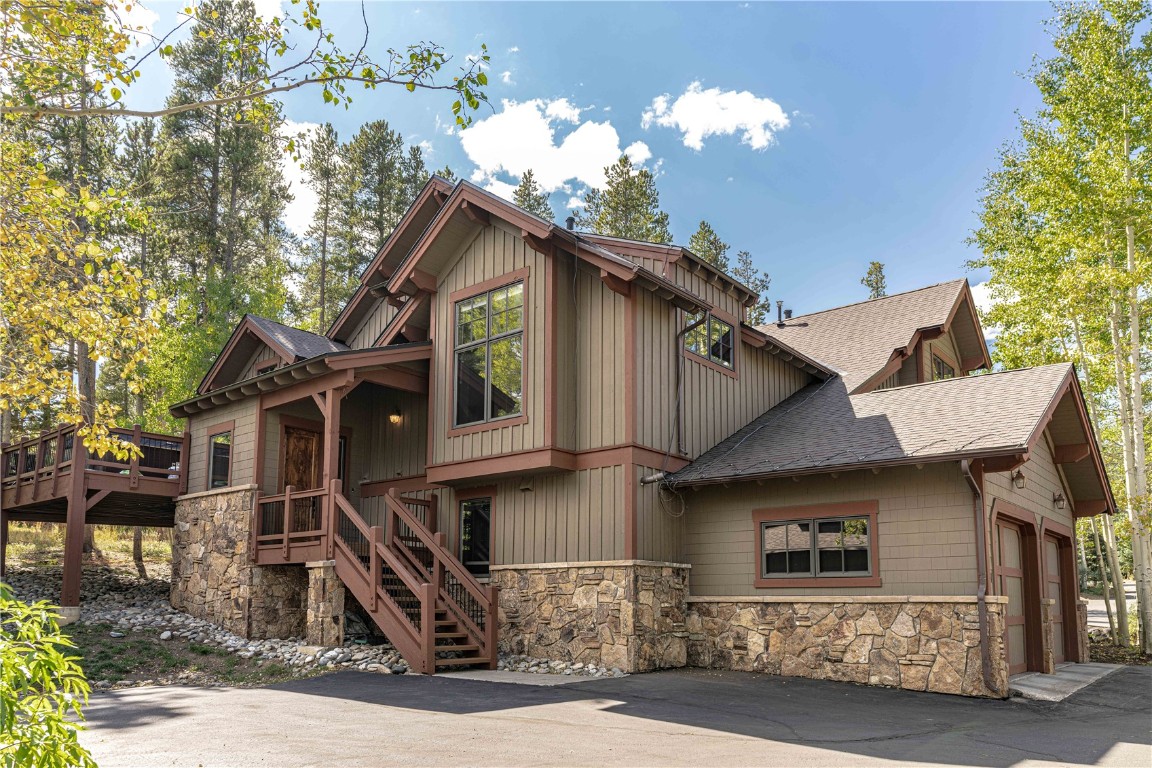 71 Cucumber Patch Placer Road, Unit 7 Breckenridge, CO 80424 - Photo 21 of 21 a front view of a house with a yard