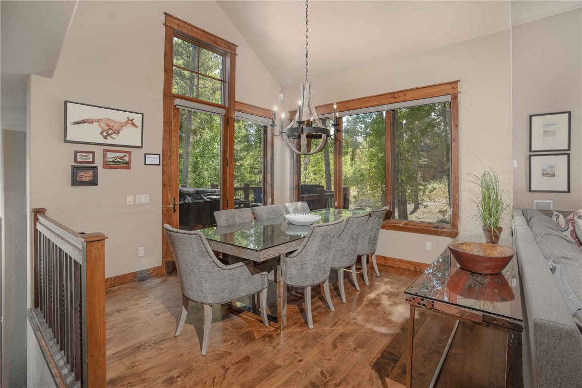 71 Cucumber Patch Placer Road, Unit 7 Breckenridge, CO 80424 - Photo 5 of 21 a view of a dining room with furniture large windows and wooden floor