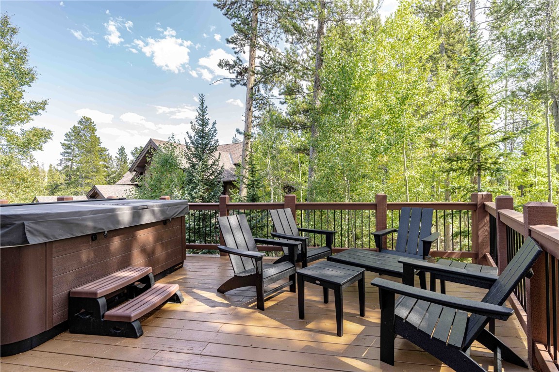 71 Cucumber Patch Placer Road, Unit 7 Breckenridge, CO 80424 - Photo 6 of 21 a balcony with wooden floor outdoor seating and trees